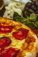 Delectable Pepperoni Pizza Surrounded by Fresh Ingredients