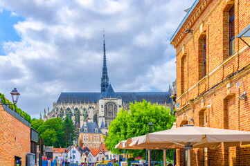 Amiens cityscape old town Saint-Leu quarter with Amiens Cathedral Basilica of Our Lady Notre-Dame...