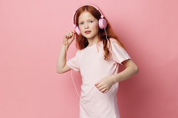Small little enjoy children listen headphone music childhood kid young girl