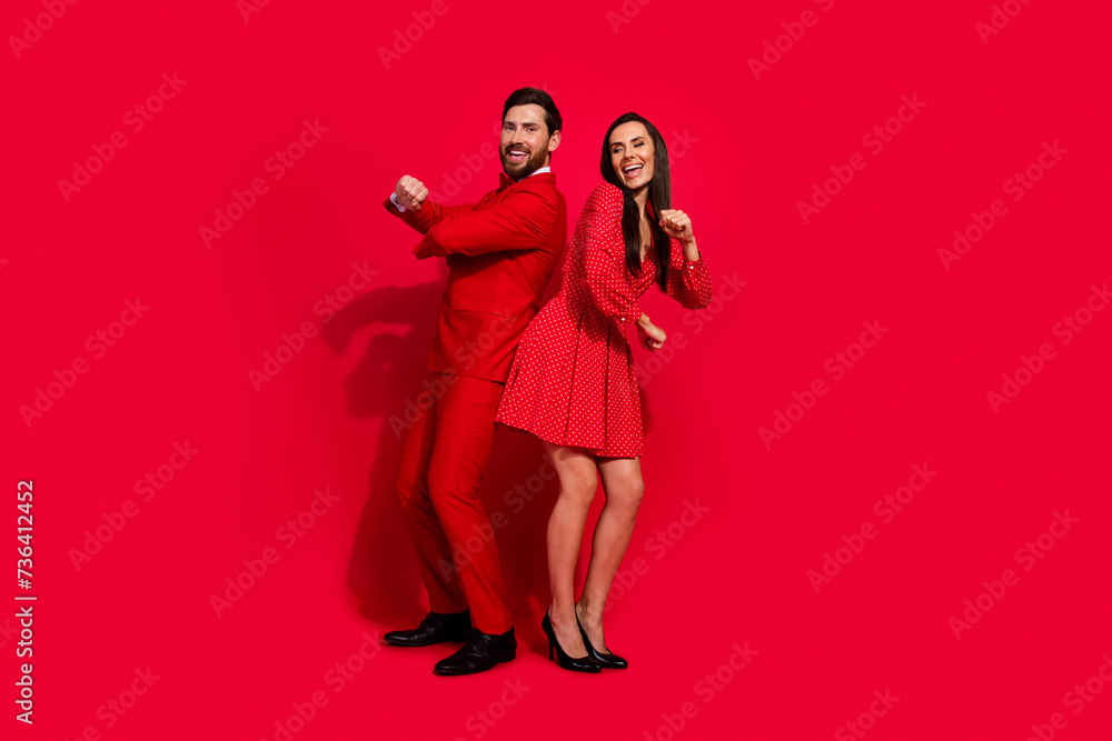 Poster full length portrait of two classy overjoyed people dance chilling clubbing isolated on bright red c