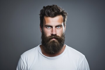 Fototapeta premium A photo of a man wearing a white shirt and sporting a beard.