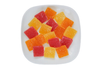 Sweet desserts in plate for the holiday. Marmalade in a plate isolated on white background. Top view.