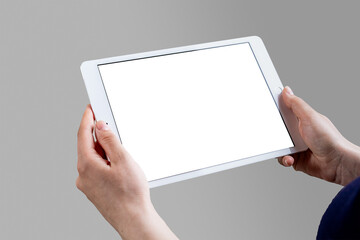 Valmiera, Latvia - April 22, 2021 - Hands holding a tablet with a blank white screen.