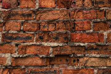Red brick wall background. Texture of an ancient red brick wall.