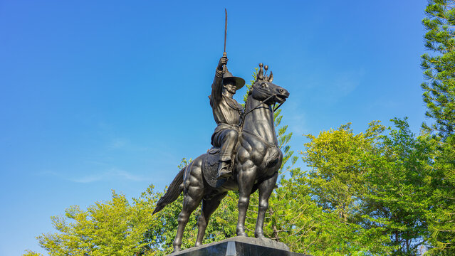 Picture of King Taksin the Great Monument. or King Krung Thonburi riding a horse and held the sword in his hand to proclaim victory. In Huai Mongkol Temple Prachuap Khiri Khan Province