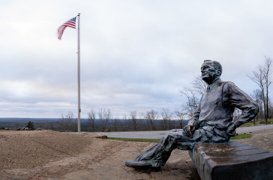 Created by the artist Martin Dawe, this life size bronze statue of FDR,  at his favorite picnic spot and the US flag at Dowdell Knob, Pine Mountain Range, Shiloh, Harris County, Georgia