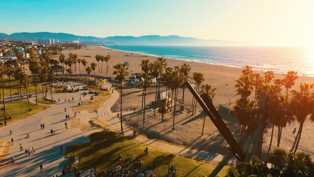 Drone footage over the bike path and skate park in Venice beach California. 