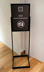 NO PHOTOGRAPHY sign posted indoors