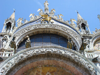 View of facade of St. Mark's Cathedral on the sunny day. Close-up. Venice. Italy.