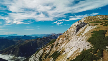 Naklejka na ściany i meble Panoramic view of majestic mountain peak Karlhochkogel in untamed Hochschwab mountain region, Styria, Austria. Scenic hiking trail on sunny day in remote Austrian Alps. Wanderlust in alpine spring
