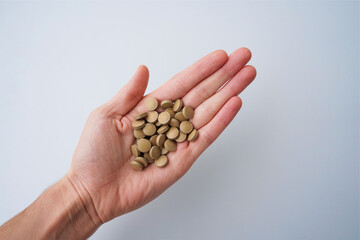 pills in hand iron brown