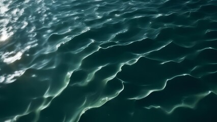 Fototapeta premium Background with waves on dark water.