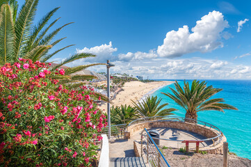 Landscape with Morro Jable in Fuerteventura, with azure waters and sandy shores offering a tranquil...