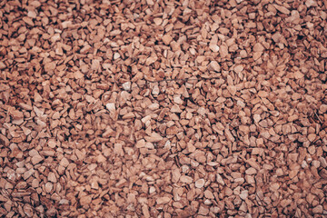 Red gravel, crushed stone, small stones, gravel texture stones background. small stones in the...