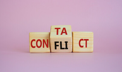 Contact and Conflict symbol. Wooden cubes with words Contact and Conflict. Beautiful pink background. Contact and Conflict and business concept. Copy space