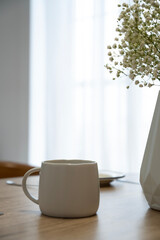 Mug with coffee on the table. A cup of tea on the table.