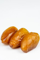 Close-up of dates against a white background. Ramadan concept.