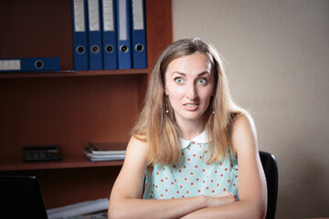 Female emotional portrait in the office. - 736503474