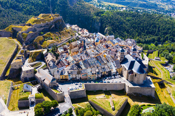 Aerial view of French fortified town of Briancon overlooking ancient fortress on hilltop and two...
