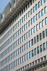 Facade of a modern building in a large city, featuring sleek architecture and contemporary design