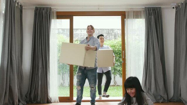 Holiday Concept Of 4k Resolution. A Family Is Helping To Move Things Into Their New Home.