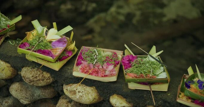 Balinese Canang Sari Offerings. Vibrant baskets with flowers to the divine, a Balinese ritual.