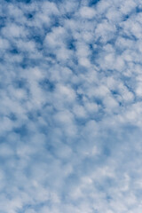 cloudy sky background for wallpaper and design, day skyscape with white beautiful clouds and blue...