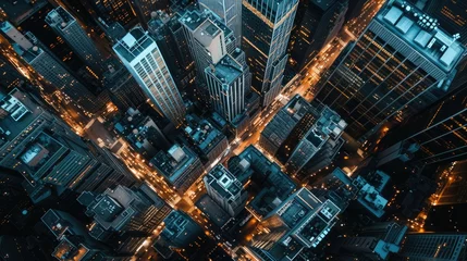 Big city from top view at night with huge buildings and street lights.