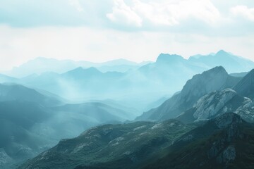 A breathtaking view of a serene mountain landscape enveloped in mist.