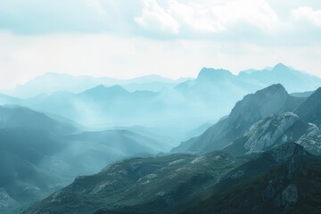 Obraz premium A breathtaking view of a serene mountain landscape enveloped in mist.
