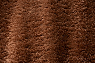 Texture of a brown faux fur as a background.