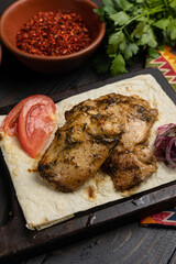 Georgian meat dishes on a dark wooden table 