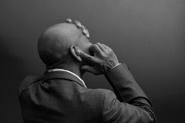 deafness suffering from hearing loss on grey black background with people stock image stock photo	