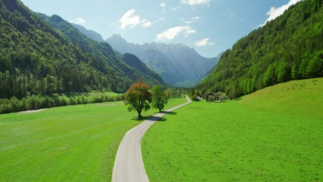 Aerial view of a rural road in alpine scenery of Logar valley, Slovenia