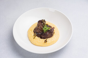 Delicious baked veal cheeks on a plate