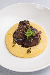 Delicious baked veal cheeks on a plate