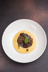 Delicious baked veal cheeks on a plate