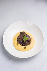 Delicious baked veal cheeks on a plate