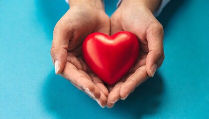 red heart in hands on a blue background 1