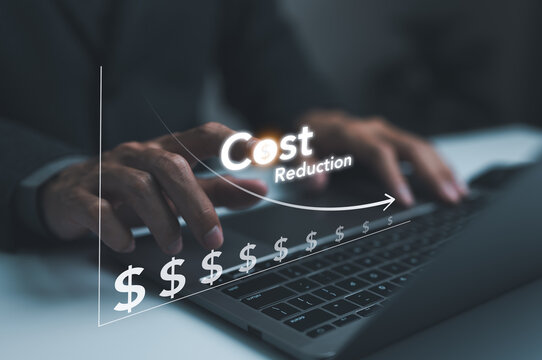 Cost reduction concept. Businessman working on company cost saving. Cost wording on decrease money with down arrow. Cost Management, Economy recession, low budget, Effective business, Expense reduce,