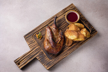 Delicious roast duck leg on a plate