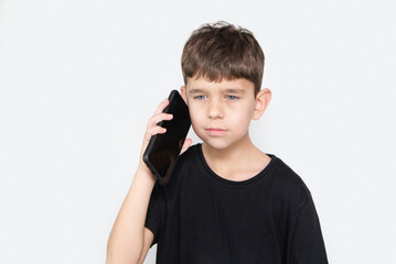 The young boy misses his mother very much when she is at work and often calls her on phone, mother tells her son encouraging words, asks him to study. The boy talks to his mother by phone