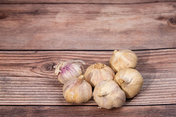 organic garlic,garlic bulb on wooden background