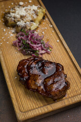 a delicious meat dish of Asian cuisine in a restaurant or pub. Close-ups