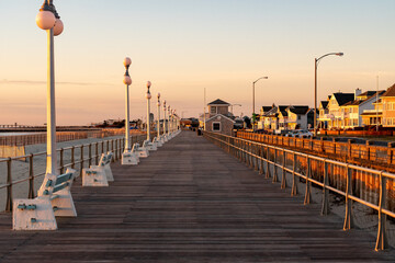 Avon By the Sea, New Jersey, USA - Golden hour sunrise on the boardwalk 