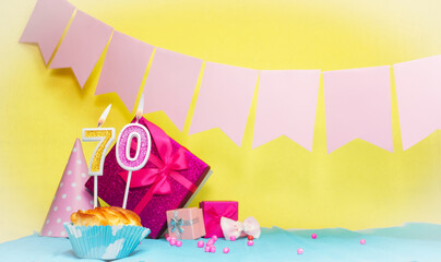 Date of birth with cake and number  70. Colorful card happy birthday for a girl. Copy space....