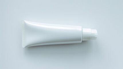 A simplistic view of an oval-shaped hand cream tube, empty and set on a pure white backdrop.