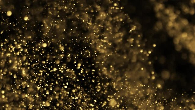 Gold Particles Moving Background. fast energy flying wave line with flash lights. Particle from below. Particle gold dust flickering on black background. Abstract Footage background for text.