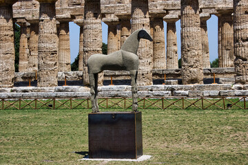 The sand horse, 4-meter sculpture built with the sand of Paestum with the Basiliaca in the...