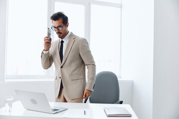 Obraz premium Manager man office talk businessman job call winner smile video laptop document phone computer call